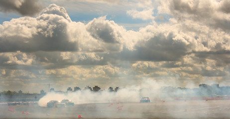 Smoke clouds drift speed the machine sunset