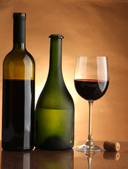 bottle with red wine and glass