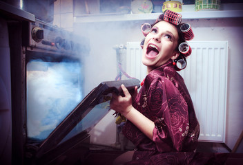 Shocked housewife in the kitchen baking something