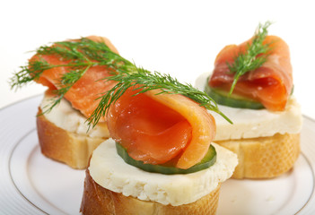 Canapes with smoked salmon  cheese and cucumber