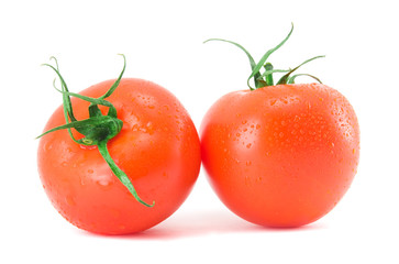Two fresh tomatoes isolated on a white background