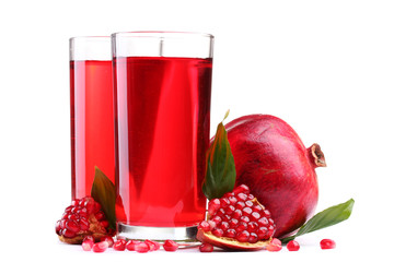 ripe pomergranate and glasses of juice isolated on white.