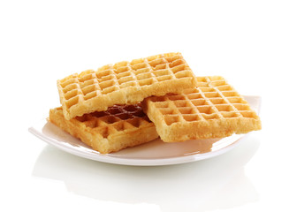Sweet waffles on plate isolated on white