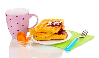 Tasty waffles with jam on plate isolated on white