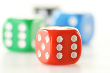 Composition with four colorful dices isolated on white