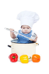 Portrait of a smiling baby sitting wearing a chef hat