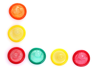 Colorful condoms isolated on white