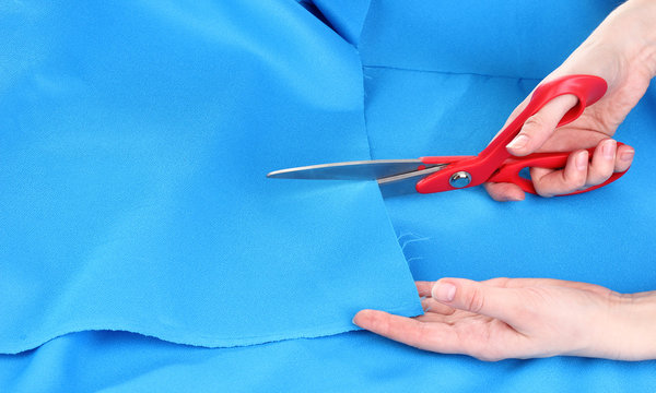 Woman Cutting Fabric