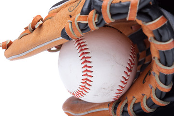 A baseball glove and ball on a white background