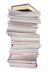 Stack of old magazines and a book