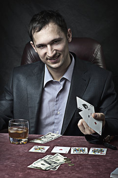business man winner playing poker