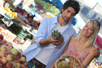 man and woman shopping vegetables