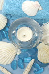 Obraz na płótnie Canvas items for the sea spa and aromatherapy on a blue background
