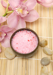 Obraz na płótnie Canvas Spa composition – pink flowers, bowl of spa salt and stones