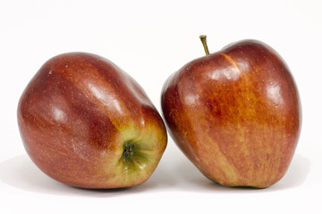 Two ripe red apples