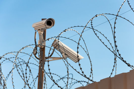 Camera surveillance and barbed wire