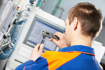 worker measuring detail tool