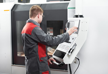 laborer working with machine tool