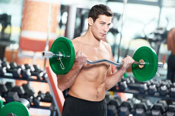 bodybuilder man doing biceps muscle exercises