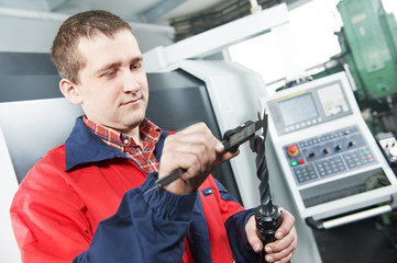 worker measuring tool by hand caliper