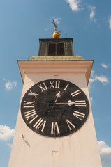 Tower clock on the sunny day