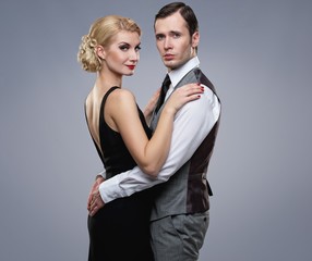 Retro couple on grey background.