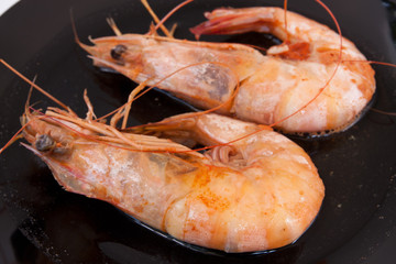 shrimp and sweet sauce on black plate