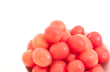 small resh tomato and white bowl isolated on white background