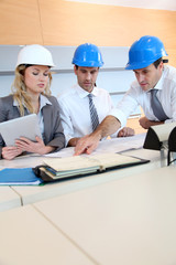 Architects and businesswomen working on construction project