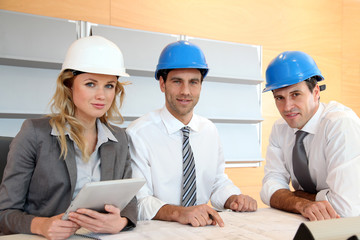 Architects and businesswomen working on construction project