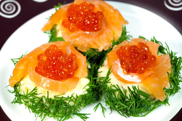 Snack with salmon and red caviar