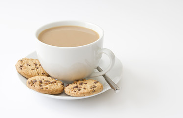 Cup of tea and cookies on white background