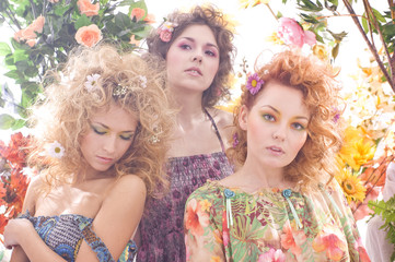 Fashion shoot of young and beautiful nymphs with flowers