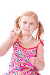 girl blowing bubbles