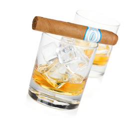 Two whiskey glasses and cigar