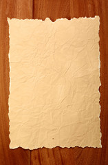 old paper on brown wood texture