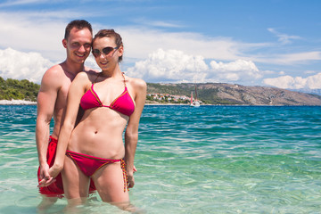 Handsome couple enoying the sea