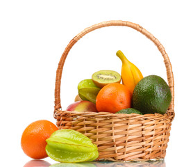 Assortment of exotic fruits in basket isolated on white