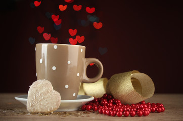 cup of coffee on wooden table on bright bokeh backdground