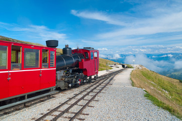 Cog railway train climbing up to the mountain