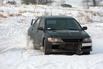 Black car on snowy road
