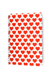 Notepad with hearts on white background. Clipping path included.