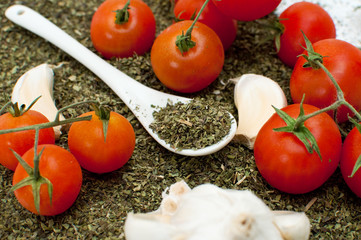 Oregano, garlic and red cherry tomato