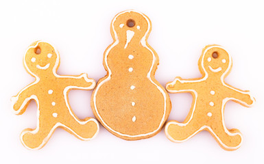 two gingerbread man with snowman