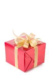 Gift wrapped with golden bow, white background