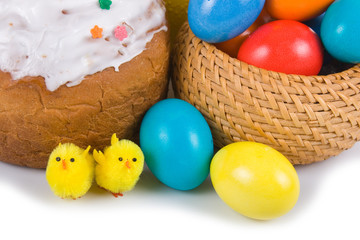 Fototapeta na wymiar Easter eggs, cake and chickens