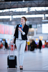 Pretty young female passenger at the airport