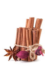 Cinnamon bundle and star anise, isolated over white