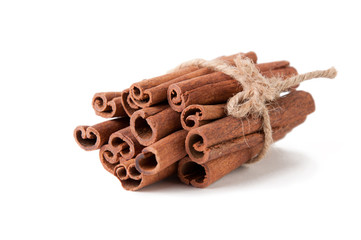 Stack of cinnamon sticks, isolated over white background