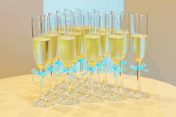Glasses of champagne with wedding ribbons
